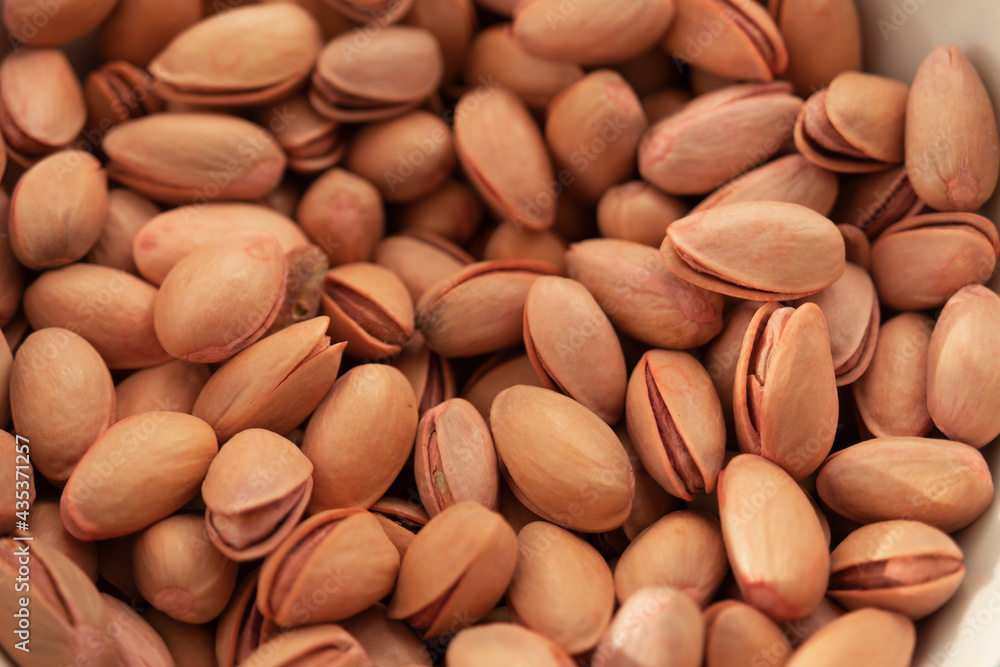 Siirt peanuts in white bowl on fabric. Siirt peanuts in white bowl on fabric.