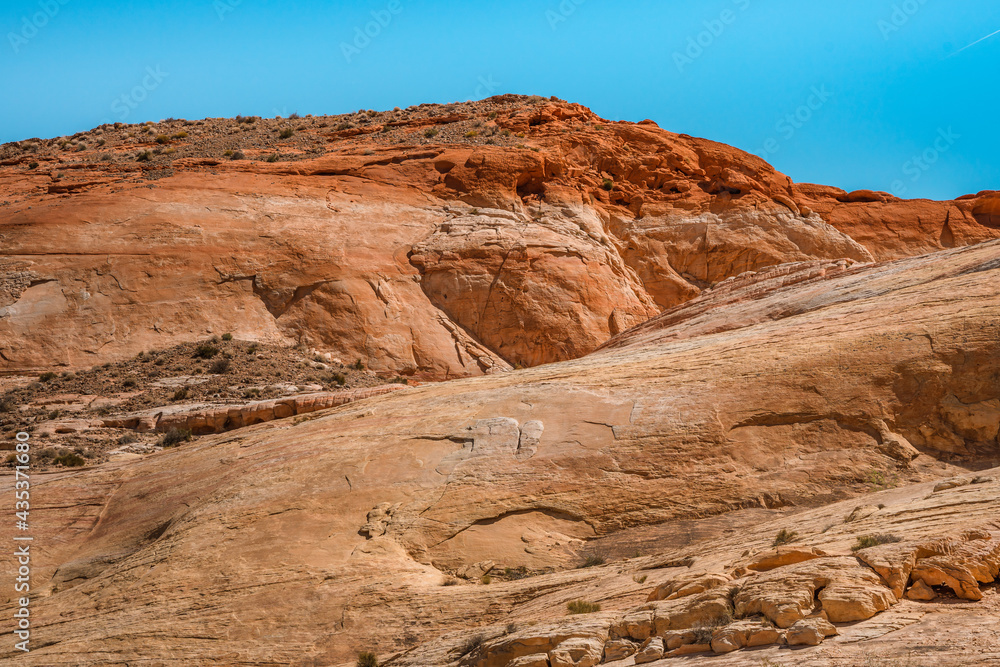Valley of Fire National Park in Nevada. Orange amazing landscape, stones of different shapes and a fire wave