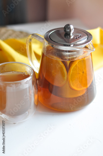 Tea pot male hand morning concept - transparent teapot in a man's hand on white backgrouhd morning routine man's care healthy lifestyle photo