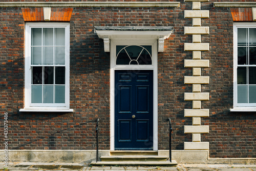 Exterior view of a British townhouse facade photo