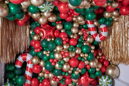 christmas decorations with colored balloons on background