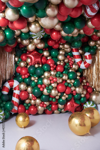 christmas decorations with colored balloons on background