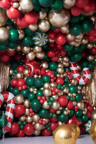 christmas decorations with colored balloons on background