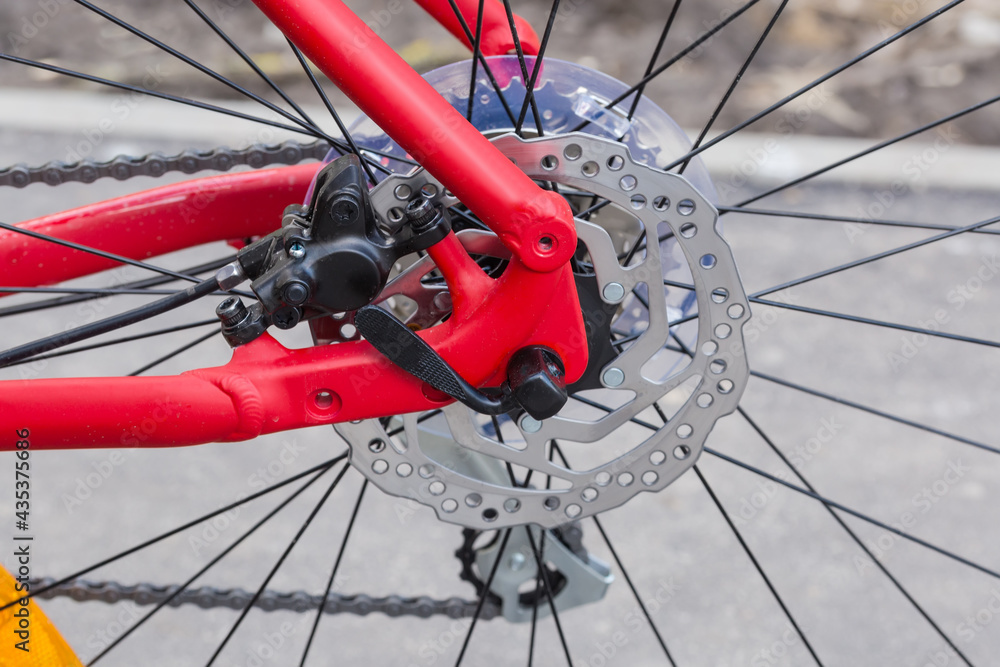 Fototapeta premium Rear disk brake of bicycle, close-up in selective focus