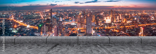 Bangkok urban cityscape skyline twilight scene with empty asphalt floor on front,copy space for text.