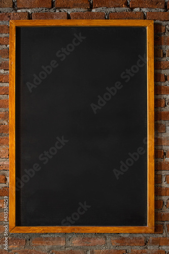 
image of blackboard frame on brick wall texture.vertical image
