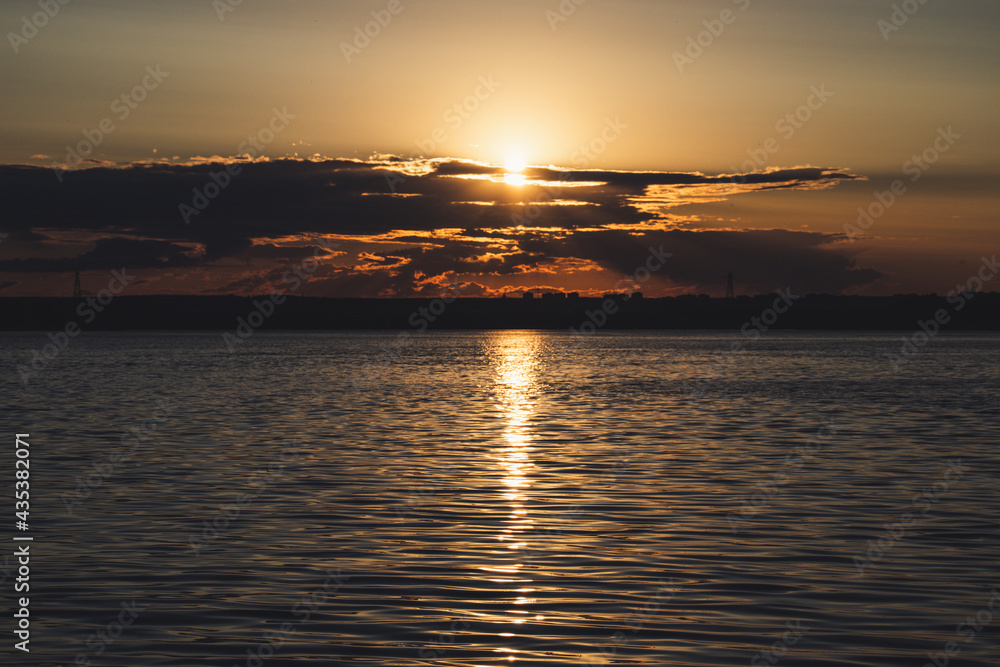 Naklejka premium sunset over the river