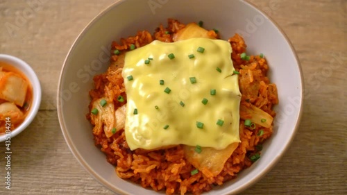 kimchi fried rice with pork and topped cheese - Asian and fusion food style photo