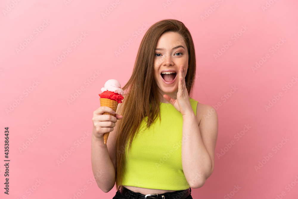 Teenager girl with a cornet ice cream over isolated pink background with surprise and shocked facial expression Teenager girl with a cornet ice cream over isolated pink background with surprise and shocked facial expression