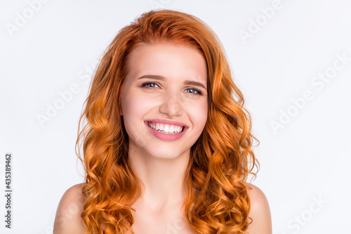 Photo portrait of young model with curly red hair smiling having good mood isolated on white color background