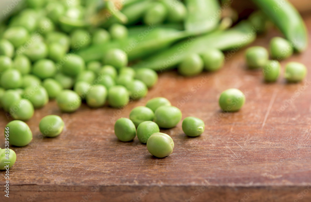 Green pea on rustic wooden background with copy space, natural wooden table. Green pea on rustic wooden background with copy space, natural wooden table.