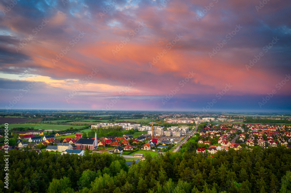 Aerial landscape of small village in Poland at sunset.