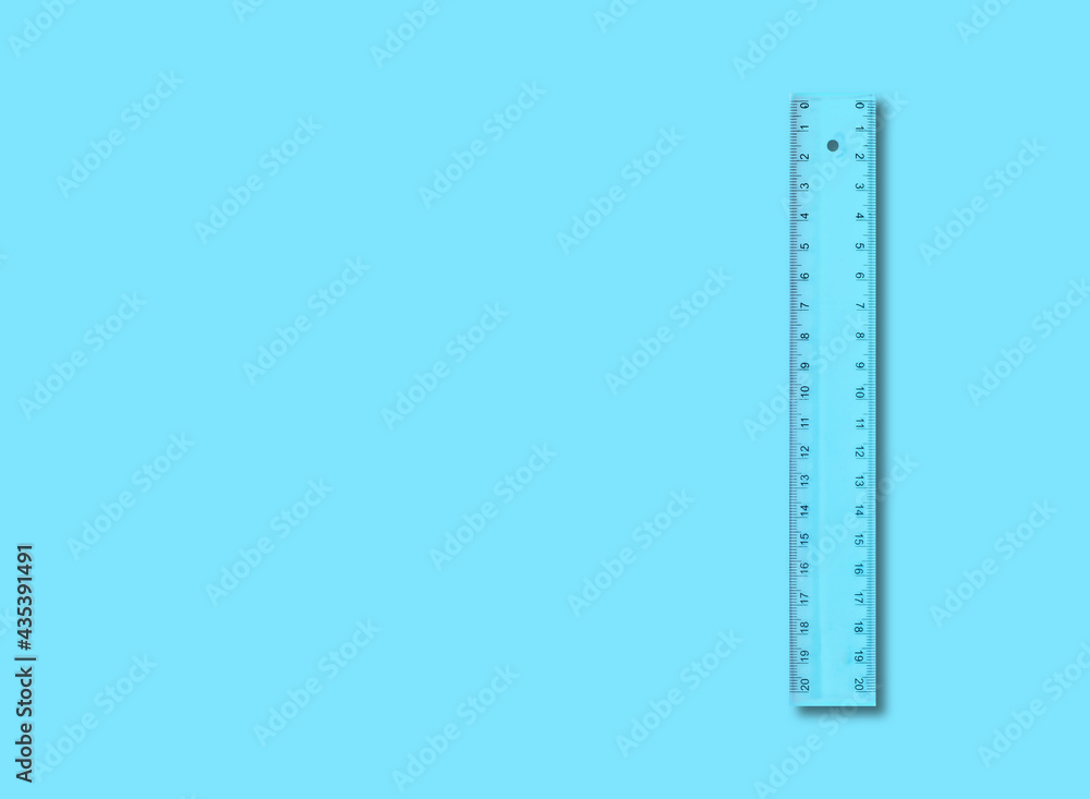 Science and education - Plastic blue school ruler isolated blue Science and education - Plastic blue school ruler isolated blue