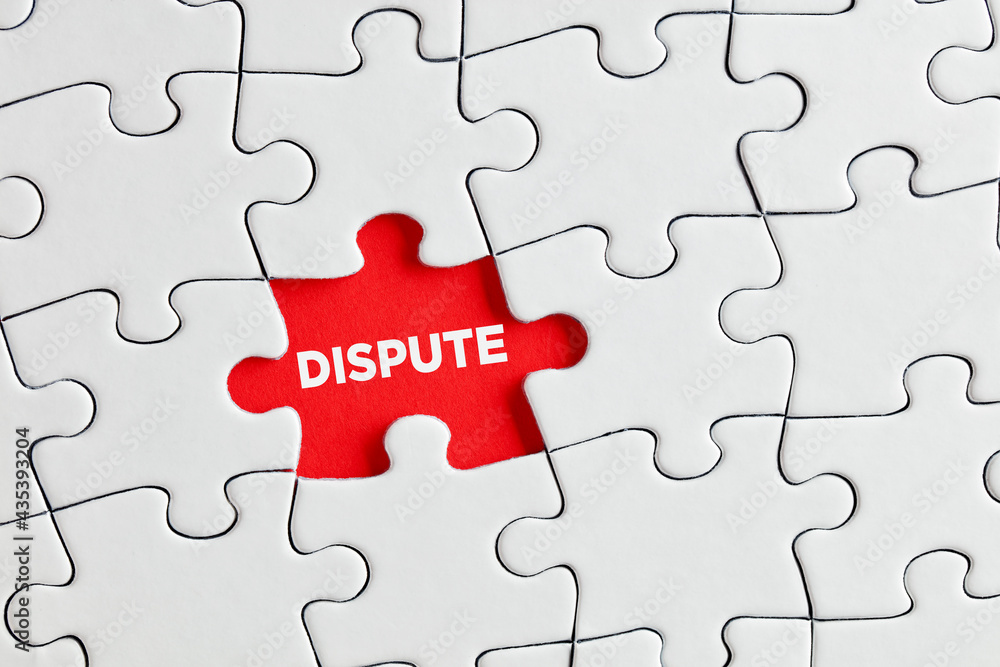 The word dispute written on red missing puzzle piece. To discover the hidden dispute The word dispute written on red missing puzzle piece. To discover the hidden dispute