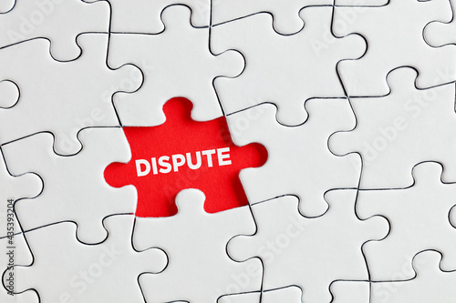The word dispute written on red missing puzzle piece. To discover the hidden dispute