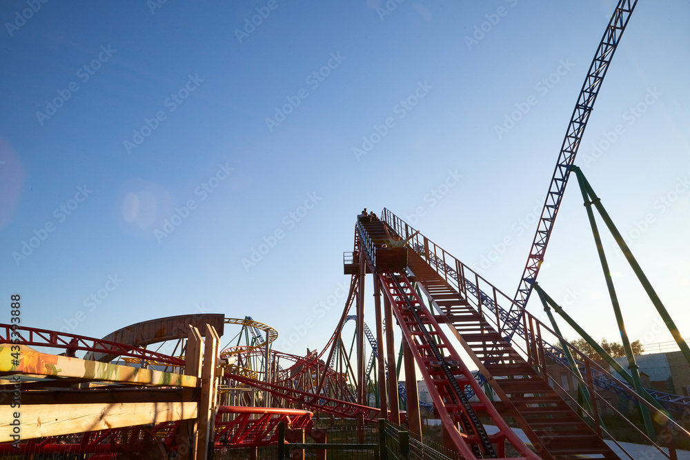Roller coaster Ride against blue sky in a nice day. Roller coaster Ride against blue sky in a nice day.