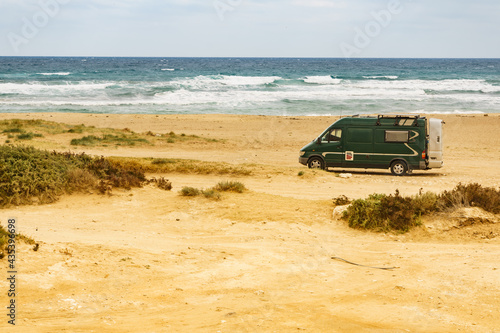 Camper van on beach in Spain. © anetlanda