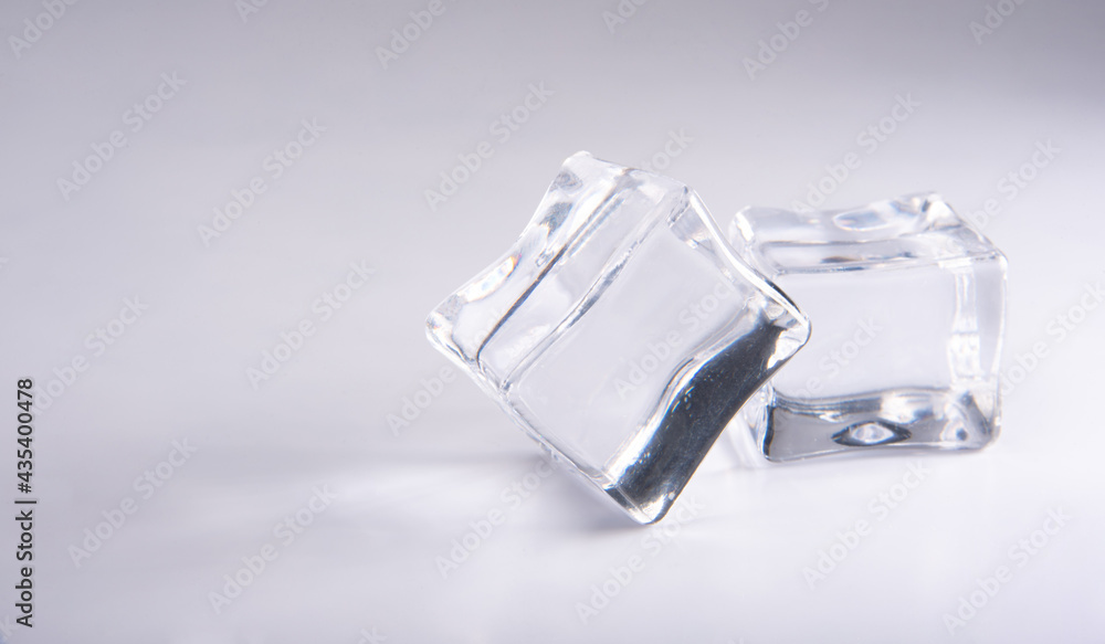 Acrylic cubes imitating ice on white surface, selective focus. Acrylic cubes imitating ice on white surface, selective focus.