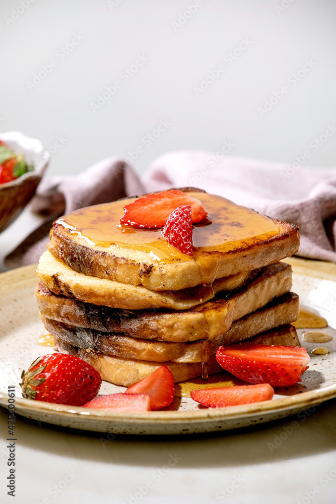 Stockpile of french toasts with fresh strawberries Stockpile of french toasts with fresh strawberries