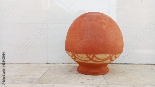 round earthen pot with white background