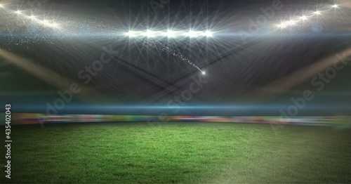 Composition of spotlights over empty stands in sports stadium