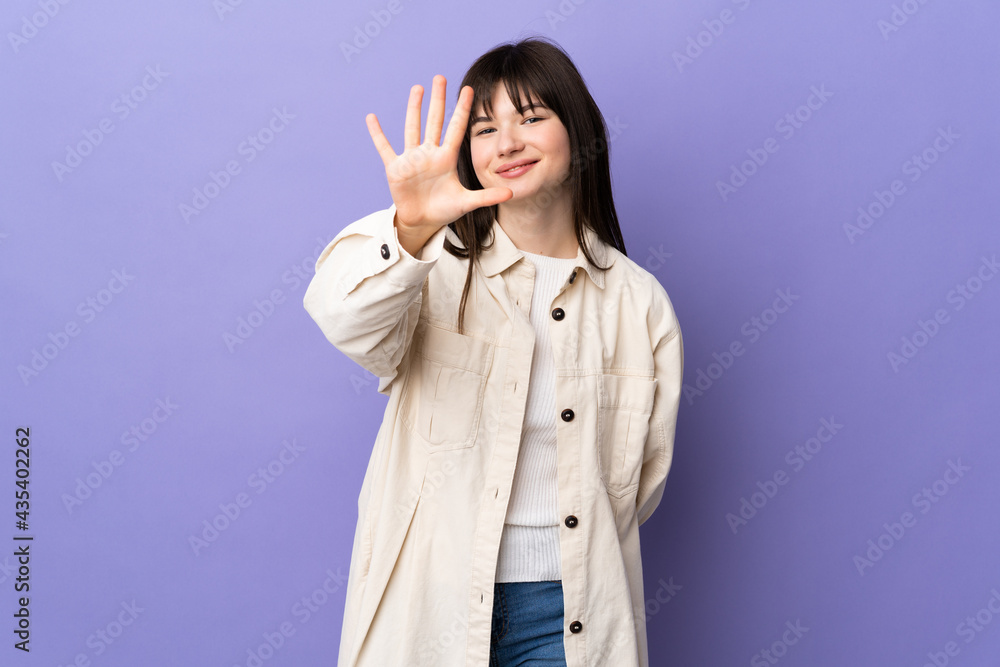 Young Ukrainian woman isolated on purple background counting five with fingers Young Ukrainian woman isolated on purple background counting five with fingers