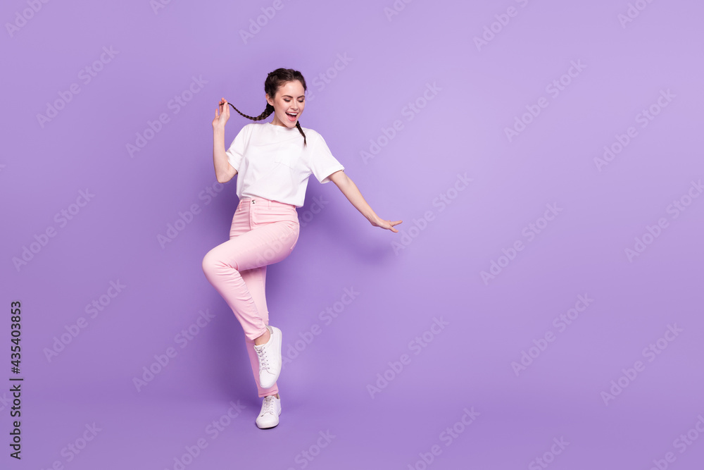 Full body portrait of excited crazy lady hand fingers hold play with tail partying isolated on purple color background