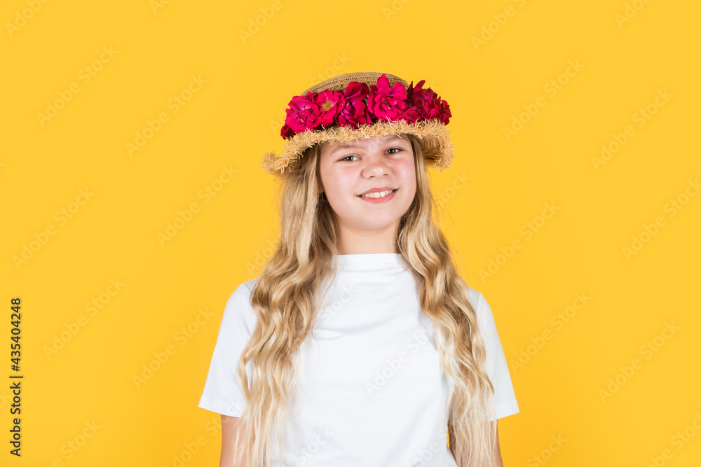 natural beauty. cheerful child in summer clothes. spring kid fashion. girl with rose flowers.