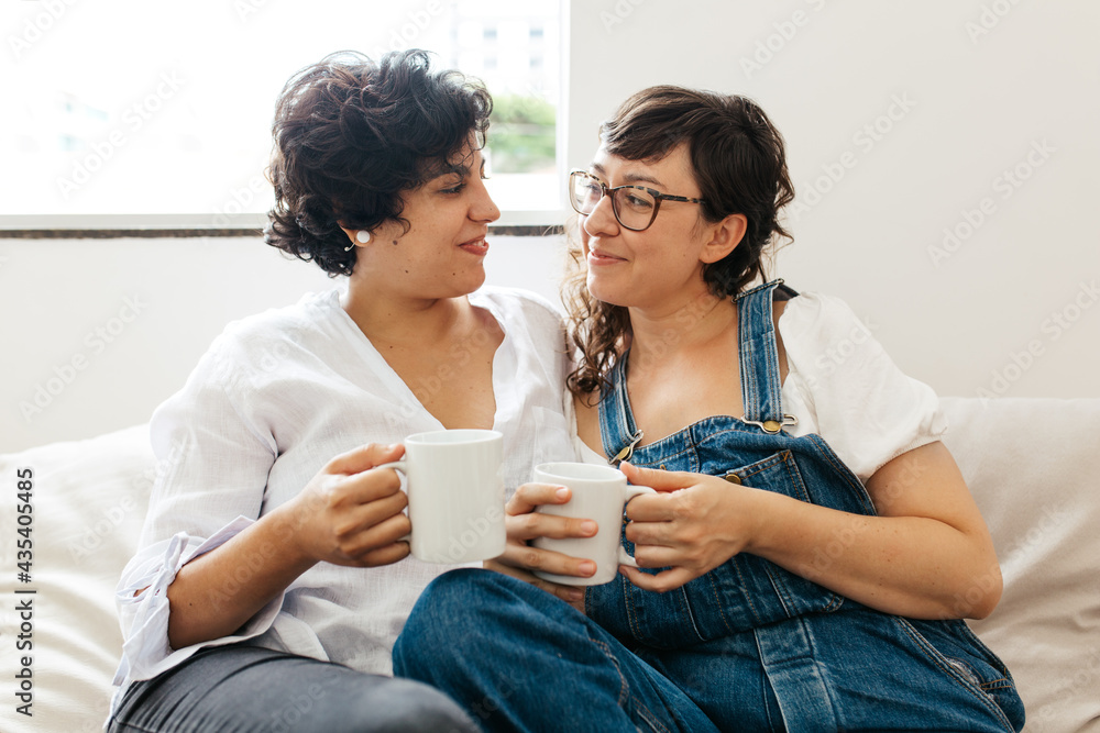 Lesbian couple sharing sweet moments - obrazy, fototapety, plakaty 