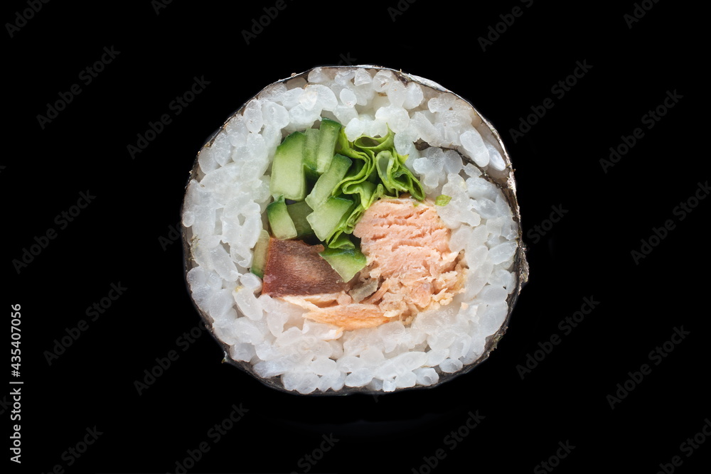 single maki roll isolated on black background single maki roll isolated on black background