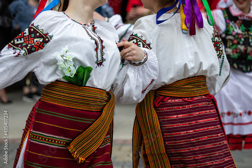 Ukrainian national clothing - embroideries. Young people in embroidered shirts dance