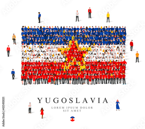 A large group of people are standing in blue, yellow, white and red robes, symbolizing the flag of Yugoslavia. photo