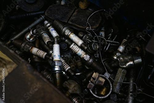 Kuwait City – Kuwait – April 15, 2021: Used and discarded auto spark plugs