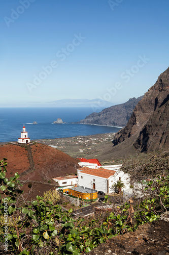 vista de los roques de salmor con la iglesia de la candelaria y su campanario de joapira, en el hierro, islas canarias. photo