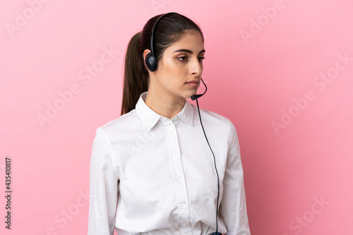 Obraz na płótnie Young telemarketer over isolated background looking to the side