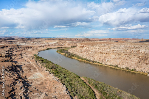 aerial view of Green River flowing below town of Green River in Utah