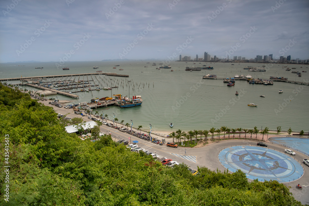   View of the Gulf of Siam and the city.Tourists walk along the promenade
