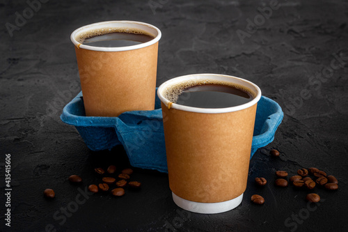Roasted beans and take away coffee in paper cup