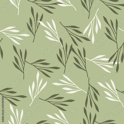 Spring season seamless pattern with random hand drawn leaf branches ornament. Light green background.