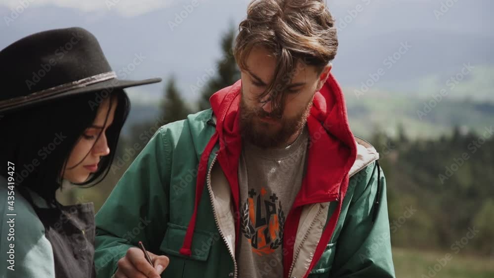 A family of artists creates a painting with a magnificent view of the mountains.Painting concept A family of artists creates a painting with a magnificent view of the mountains.Painting concept