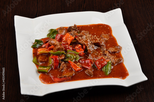 stewed vegetables with meat in tomato sauce with spices and gravy