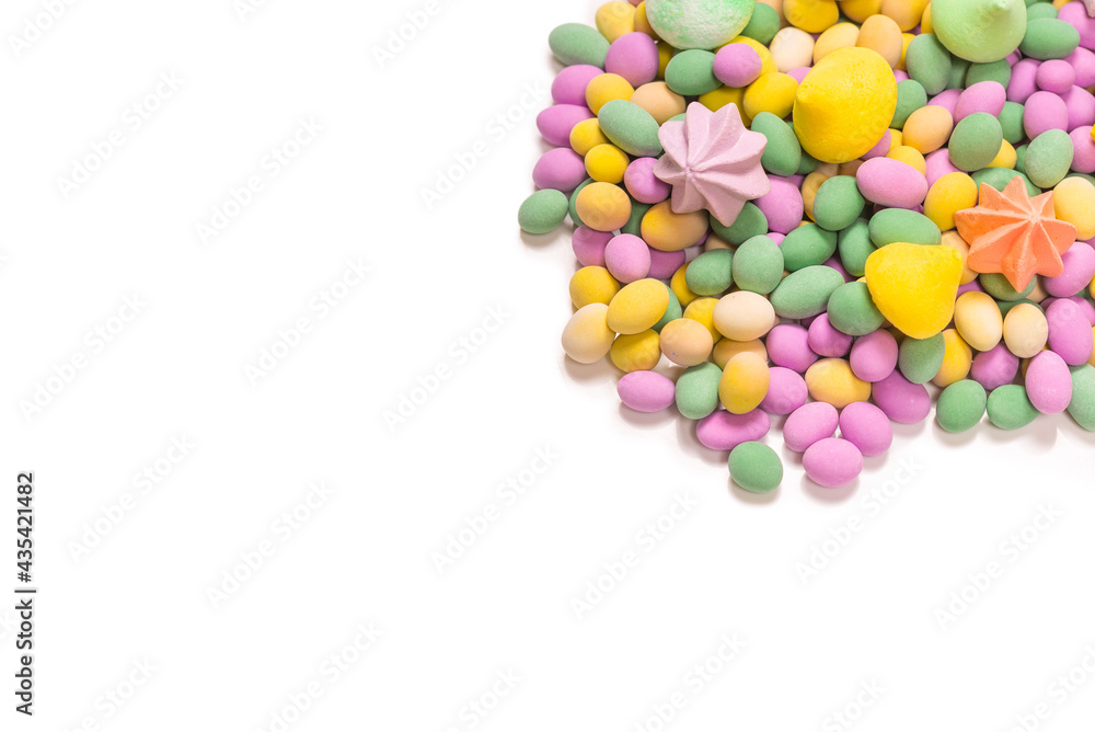 Colorful meringues and glazed peanuts isolated on a white background. Colorful meringues and glazed peanuts isolated on a white background.