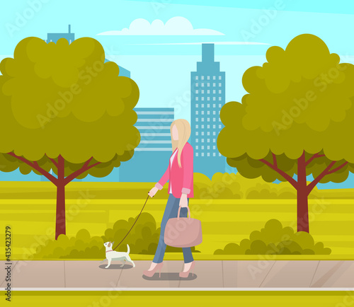 Business woman with small white dog is walking on street. Female character stylish girl spends time outdoors with her pet. Owner walks with cheerful puppy on leash in city park wih green trees