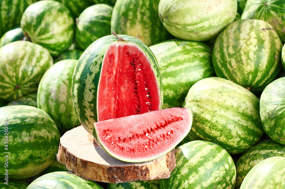 Red ripe watermelon sliced on a wooden board. Red ripe watermelon sliced on a wooden board.