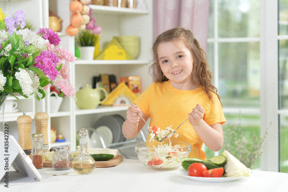 Portrait of a funny little girl cooking Portrait of a funny little girl cooking
