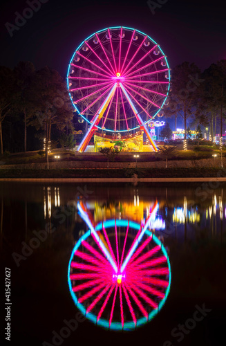 Spinning ferris wheel at night