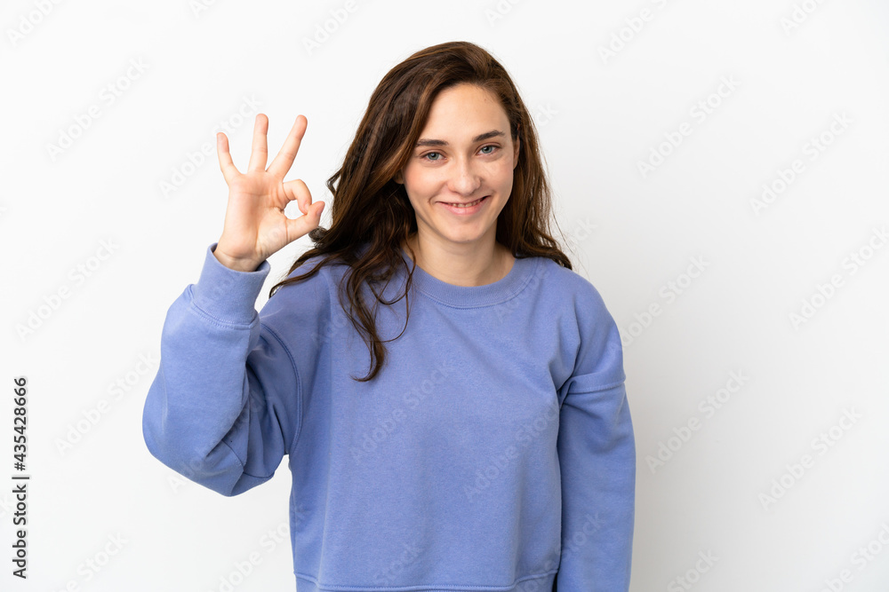 Young caucasian woman isolated on white background showing ok sign with fingers Young caucasian woman isolated on white background showing ok sign with fingers