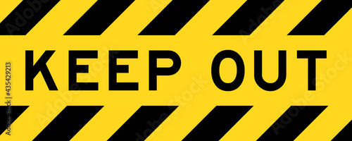 Yellow and black color with line striped label banner with word keep out