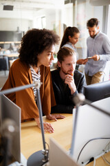 Collaboration and analysis by business people working in office
