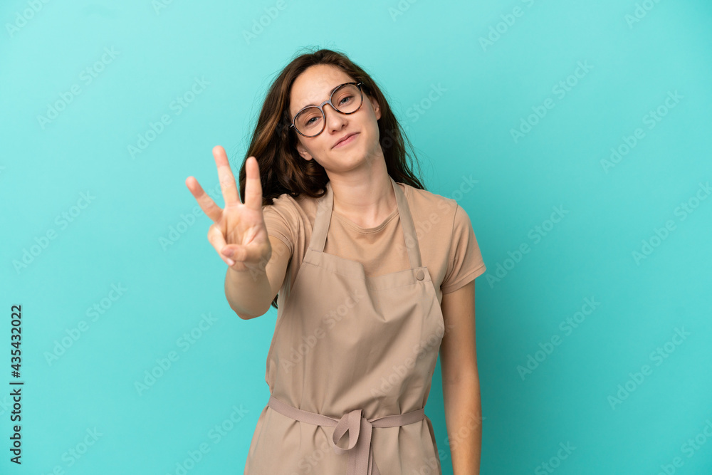 Restaurant waiter happy and counting three with fingers Restaurant waiter happy and counting three with fingers